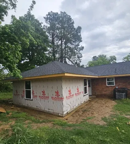 The same house part way through the work, before the new front went on