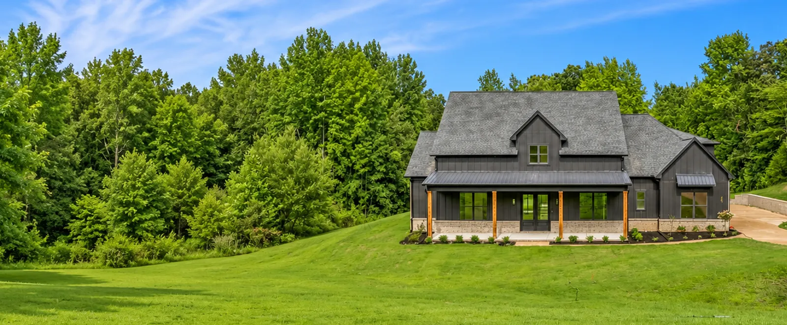 A renovated home seen across its front lawn